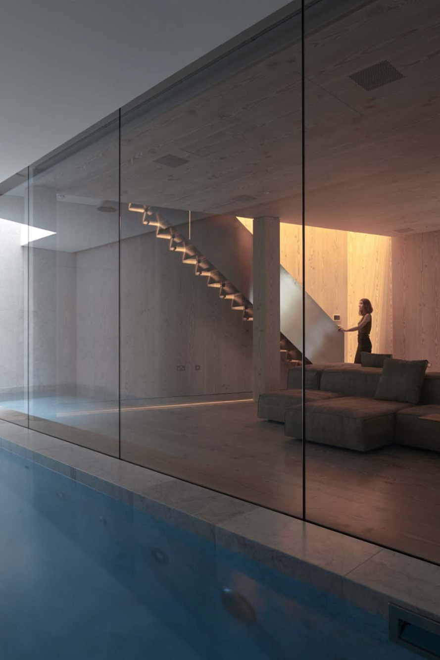 The stairs leading down to the pool of a luxury house in London