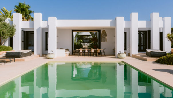 Eye-catching André Jacqmain villa for sale, reflected in its expansive pool